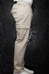 Au Noir men's beige cargo pants shown from the side, with flap pockets, belt loops, and straight legs