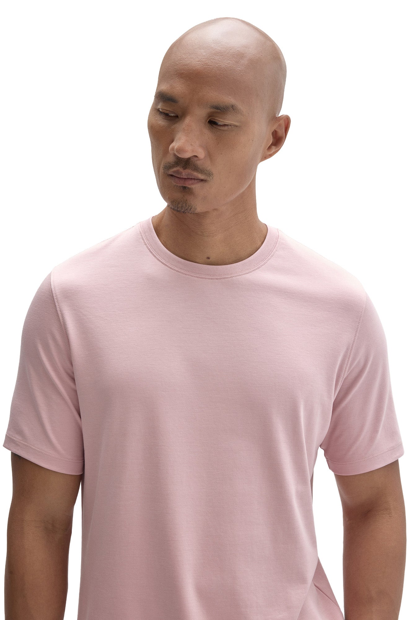 Men's close upper view of light pink crewneck Short-sleeve T-Shirt showing ribbed neckband and by Robert Barakett