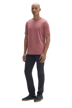 Robert Barakett men's angled full-body view of dusty pink crewneck Short-sleeve T-Shirt worn with dark pants, side view