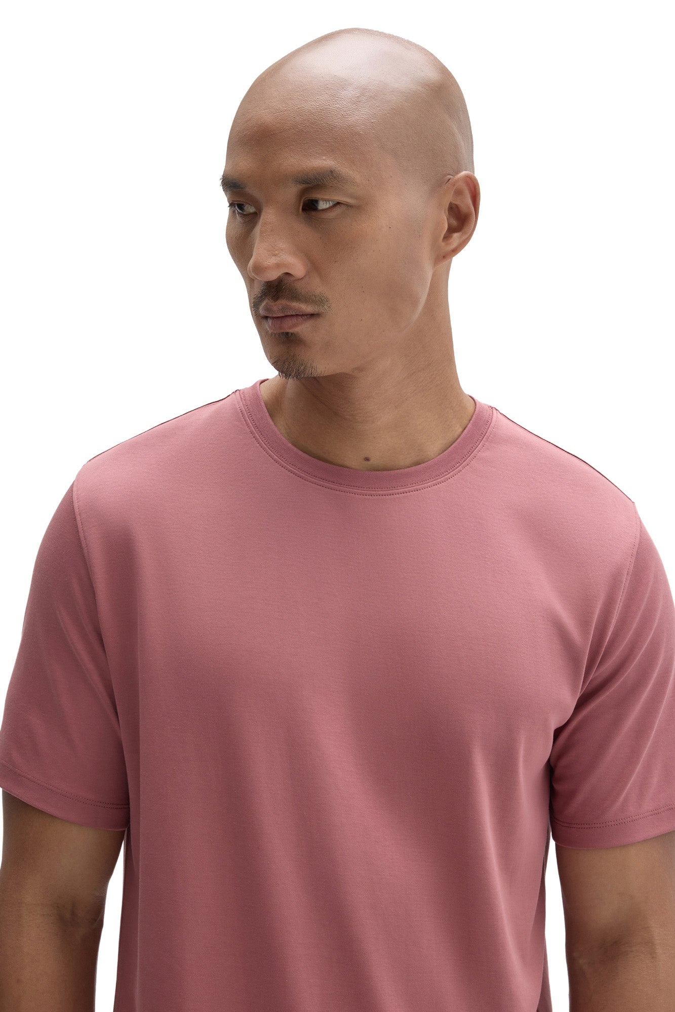 Men's close front view of dusty pink crewneck Short-sleeve T-Shirt showing collar stitching and by Robert Barakett
