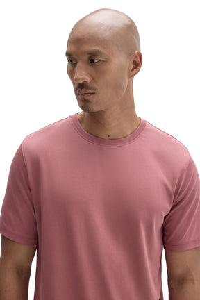 Men's close front view of dusty pink crewneck Short-sleeve T-Shirt showing collar stitching and by Robert Barakett