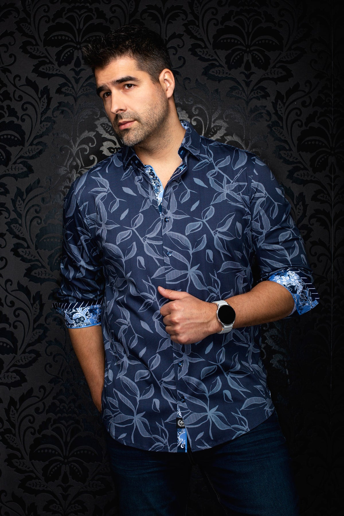 Front view of men's navy button-up shirt with light blue leaf print and rolled contrast cuffs by Au Noir