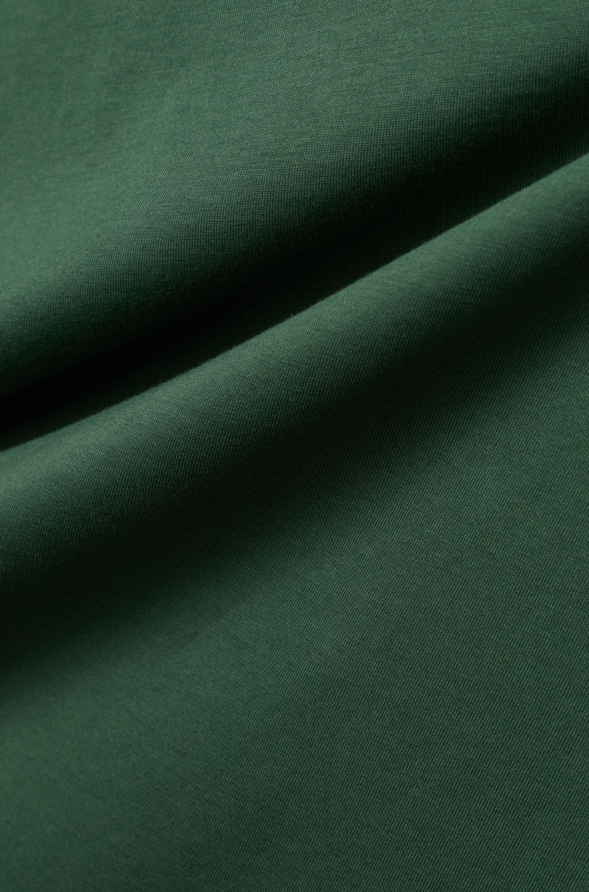 T-Shirt vert foncé avec la texture fine du tissu et jersey pour homme par Psycho Bunny, en gros plan
