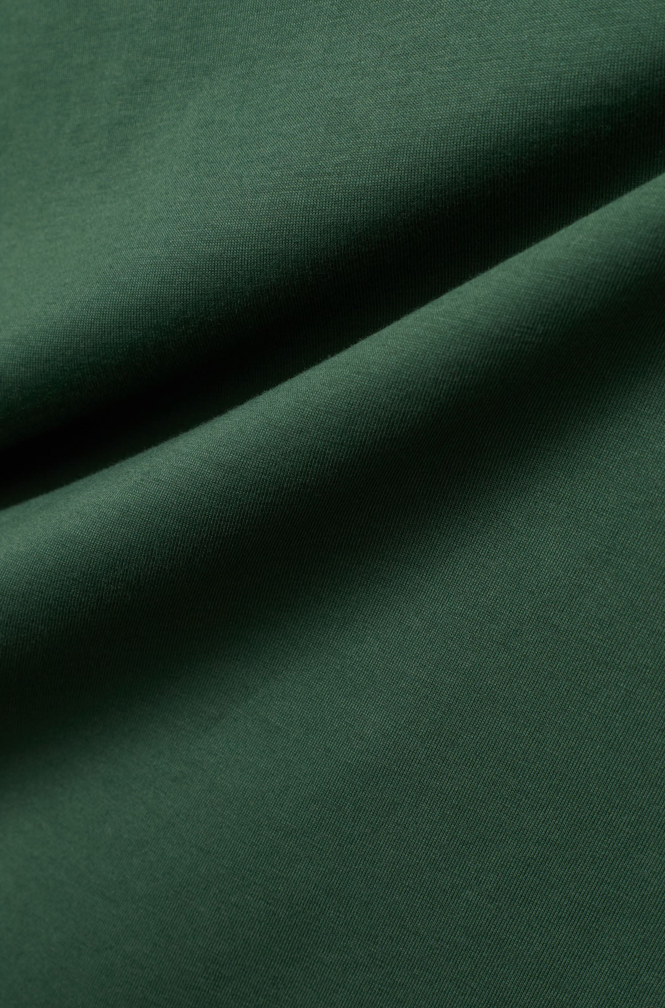T-Shirt vert foncé avec la texture fine du tissu et jersey pour homme par Psycho Bunny, en gros plan