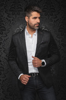 Veston noir en jacquard cachemire sur modèle, vue avant avec revers crantés et poches passepoilées pour homme par Au Noir