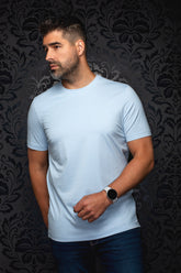 Au Noir men's light blue crewneck Short-sleeve T-Shirt on a model shown from the front