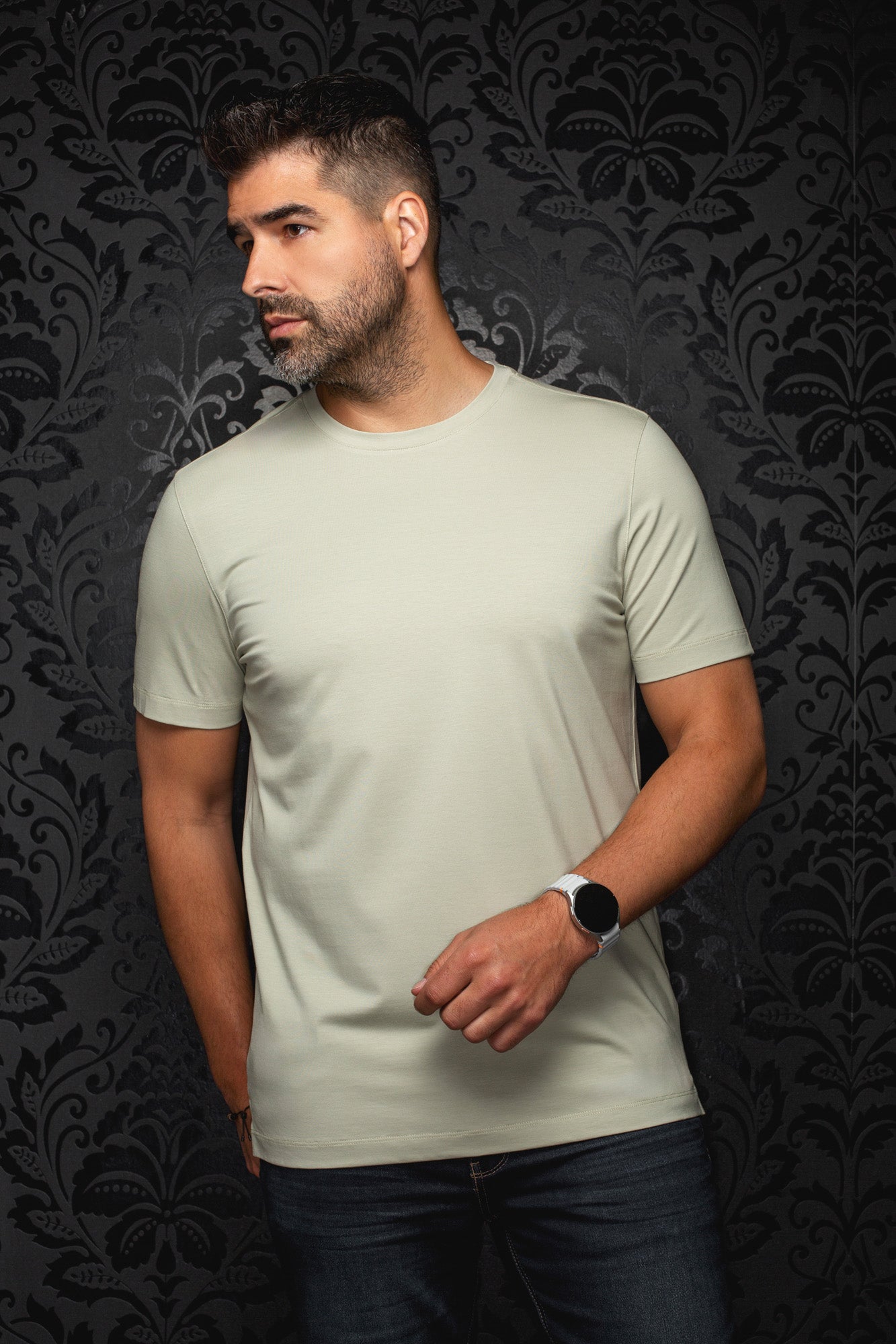 Men's pale sage green short sleeve crewneck T-Shirt on model, front view with straight hem by Au Noir