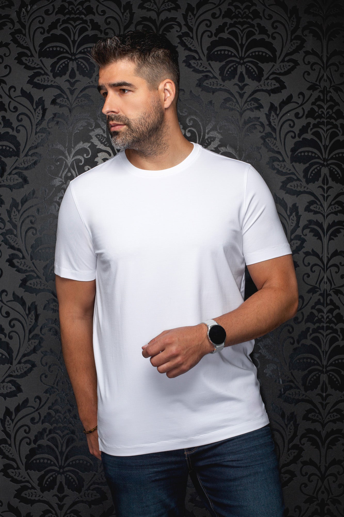 Front view of men's plain white crewneck Short-sleeve T-Shirt worn with jeans by Au Noir