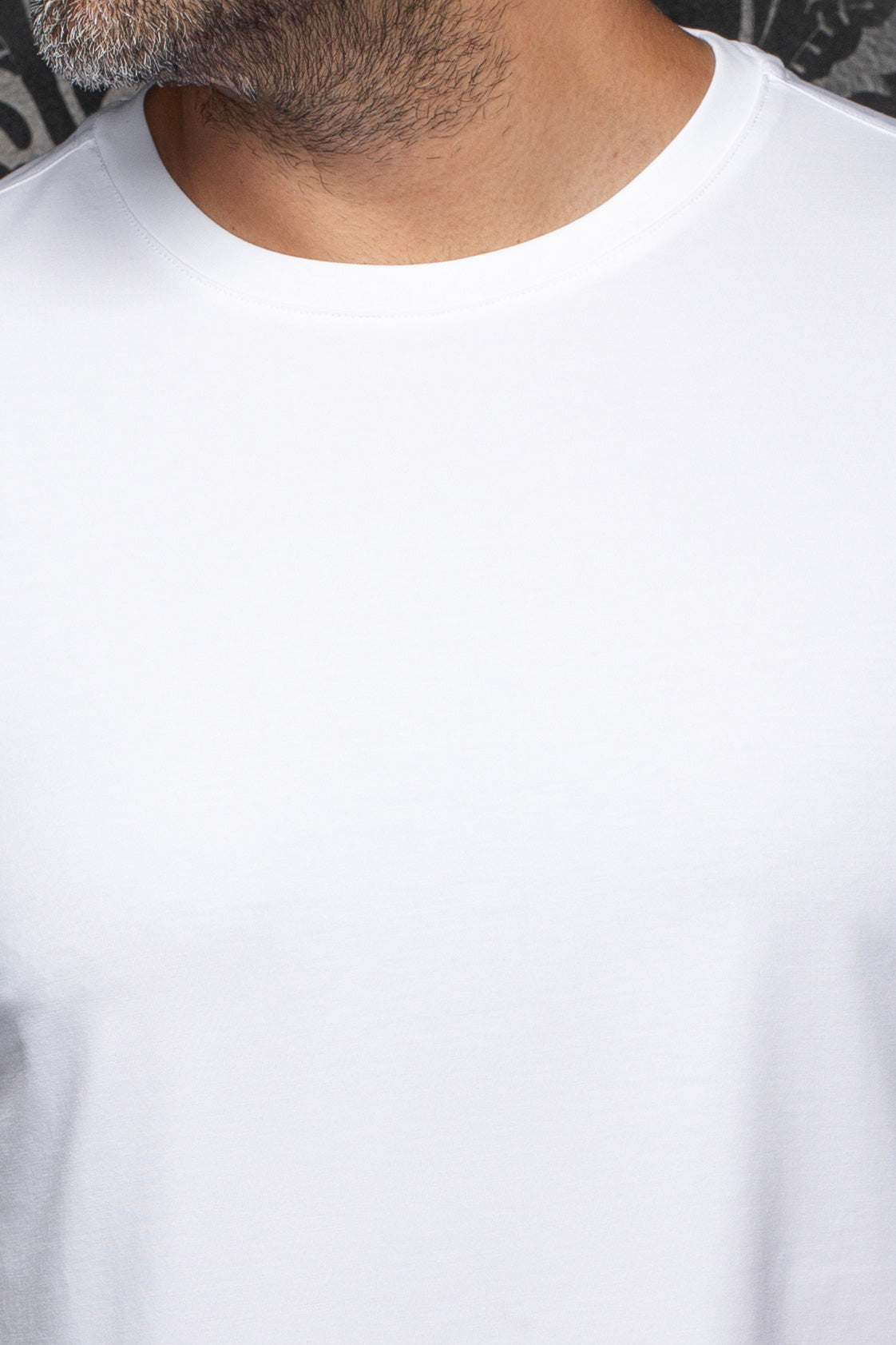 Au Noir men's plain white Short-sleeve T-Shirt crewneck, showing stitched neckline and smooth jersey, close-up