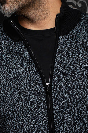Au Noir men's marled knit zip cashmere jacket showing black ribbed collar and front zipper, close view
