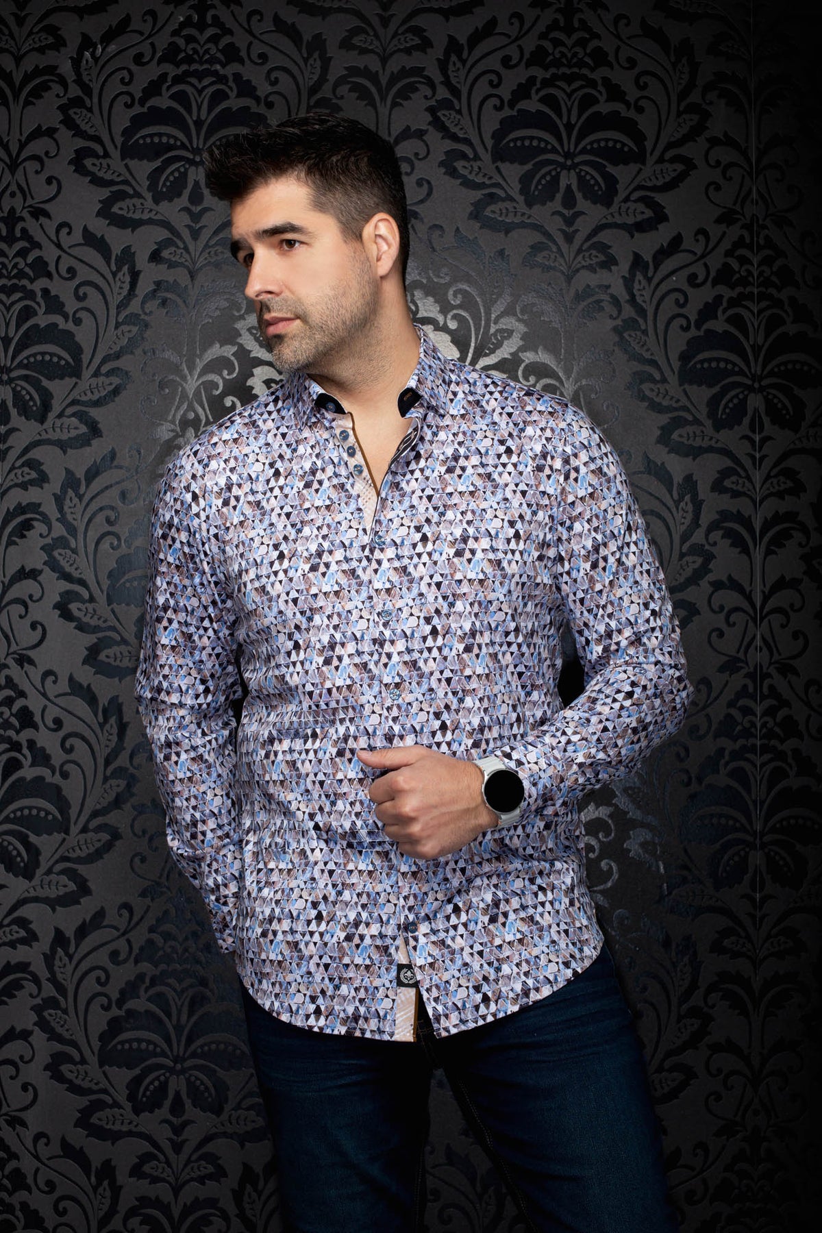 Men's angled model view of light blue and white geometric print button-up shirt with dark collar trim, side view by Au Noir