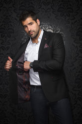 Au Noir men's black textured blazer worn open, showing red and orange patterned lining and red stitching, front model view