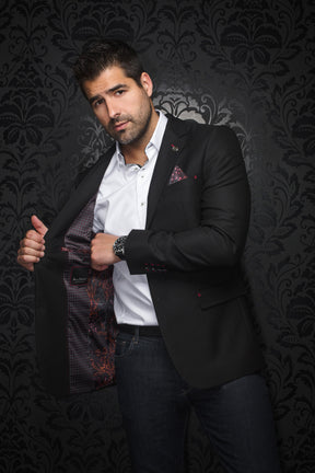 Au Noir men's black textured blazer worn open, showing red and orange patterned lining and red stitching, front model view