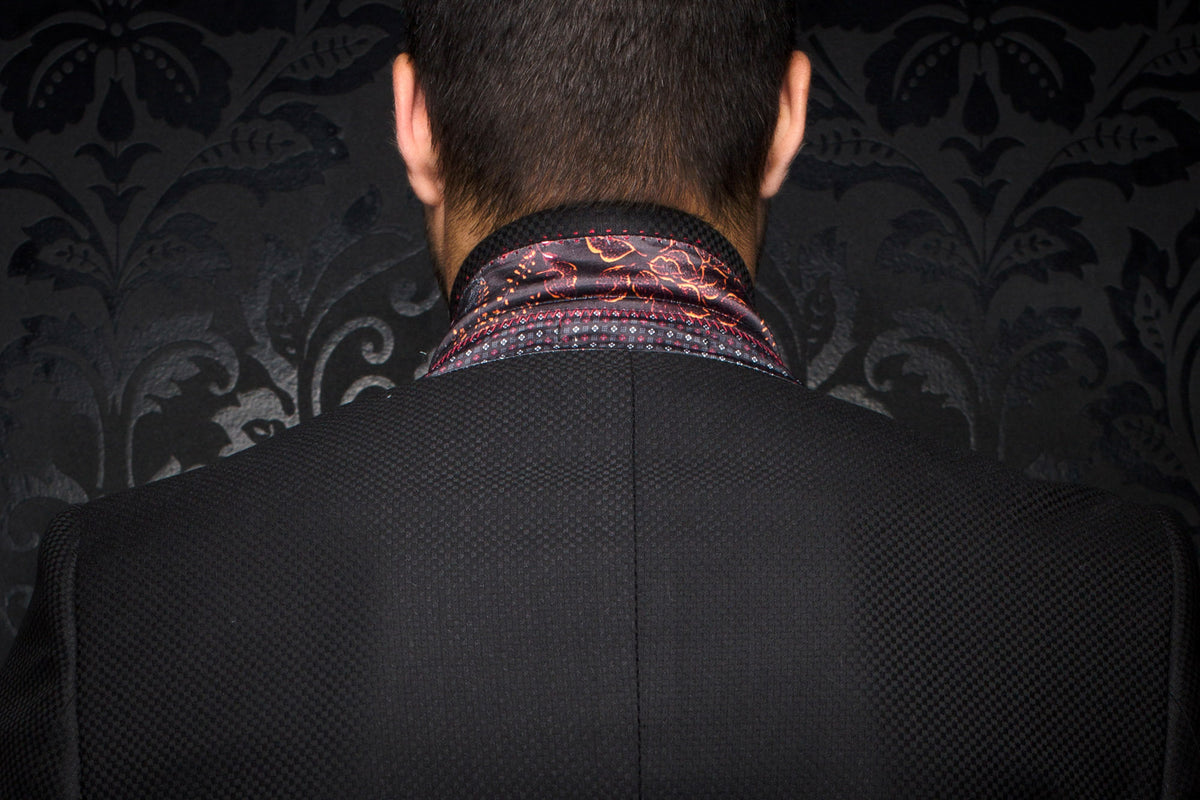 Men's back close-up of a black textured blazer with patterned collar lining and center back seam by Au Noir
