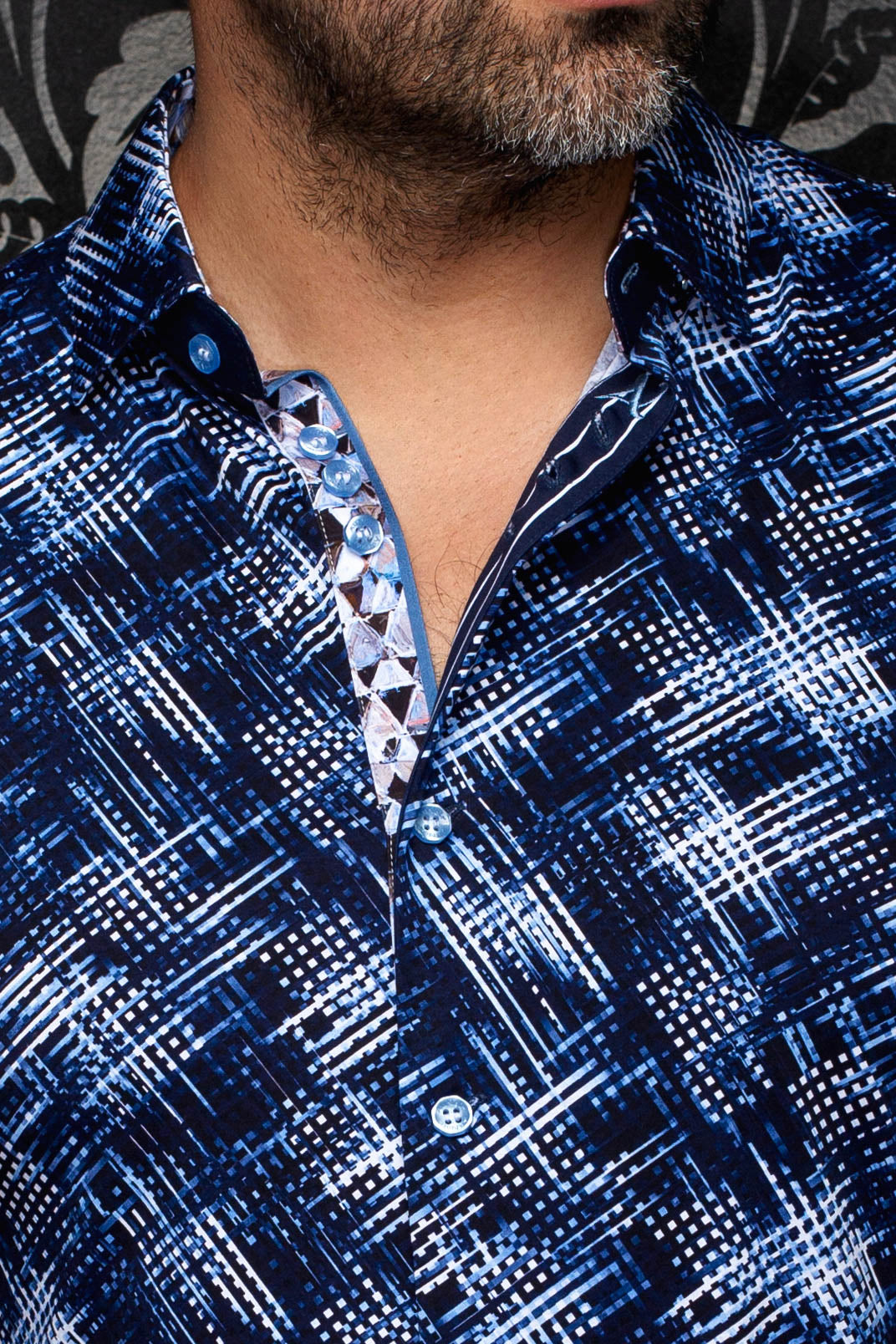 Au Noir men's navy patterned button-up shirt with open collar and light blue buttons, close-up