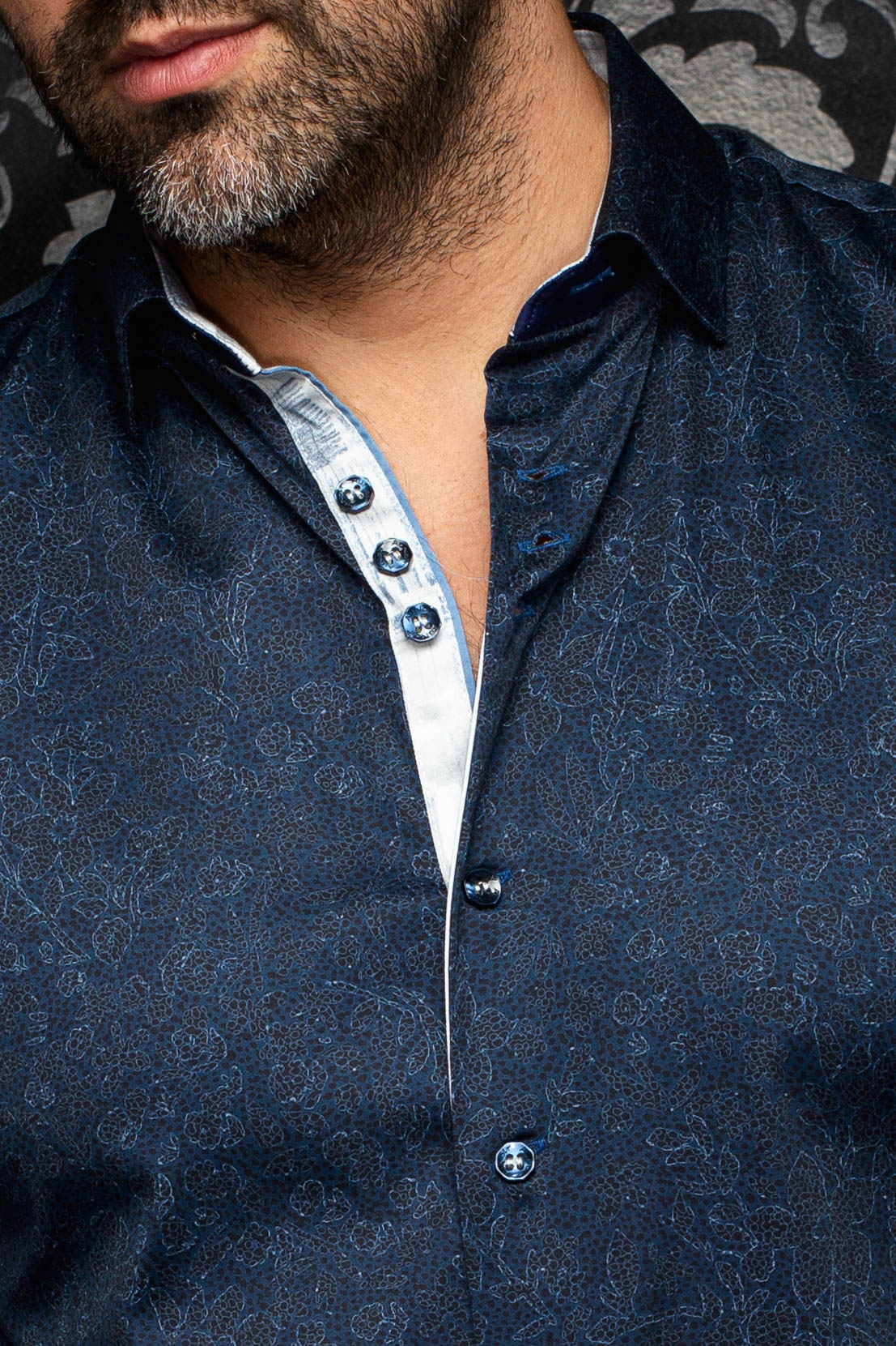 Au Noir men's navy patterned button-up shirt collar, light contrast placket and dark buttons, close-up