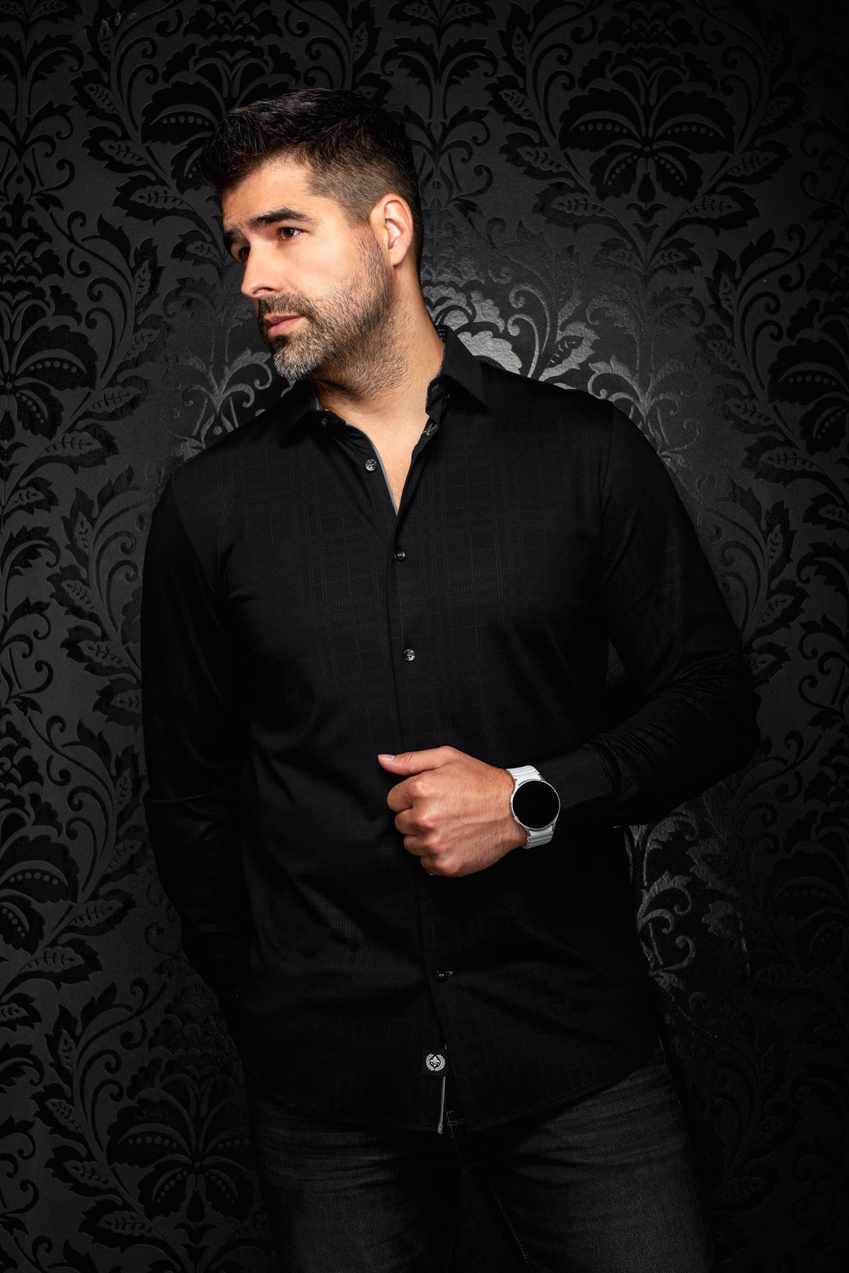 Front model view of men's black button-up shirt with tonal grid texture, point collar, and dark buttons by Au Noir