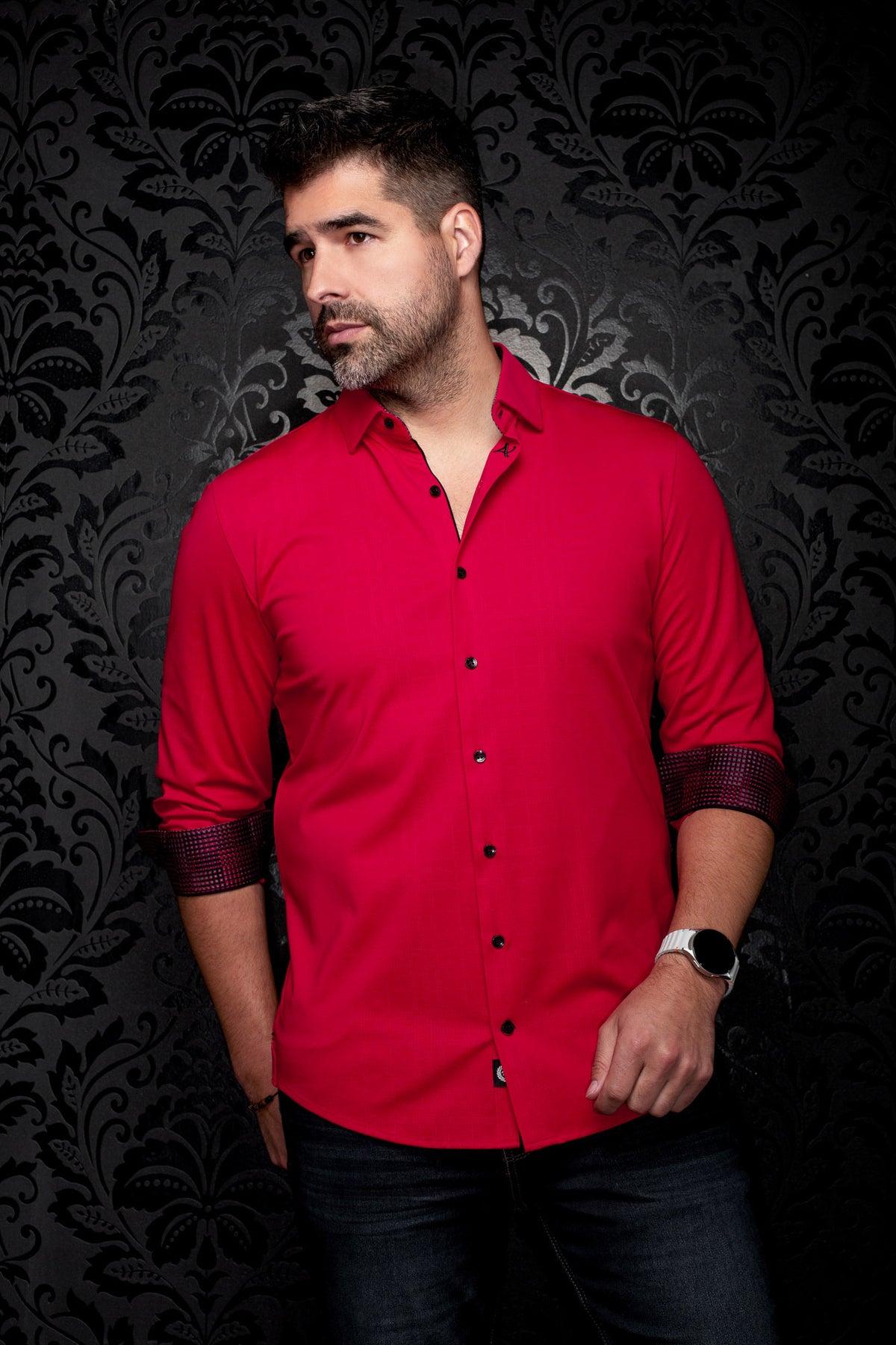 Men's red long sleeve button-up shirt on model, front angled view with rolled contrast check cuffs, side view by Au Noir