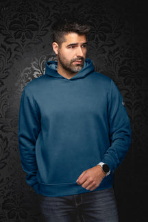 Veston sport à capuchon bleu sarcelle sur mannequin, vue de face avec capuchon et ourlet côtelé pour homme par Au Noir