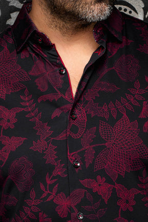 Au Noir men's black button-up shirt collar, burgundy floral print, glossy buttons and red trim, close-up