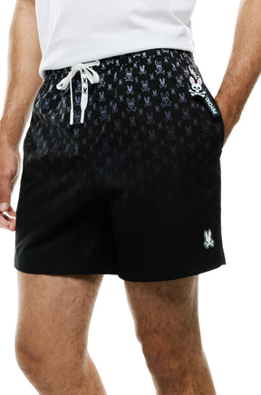 Gros plan avant du short maillot de bain noir avec étiquette côté et cordon blanc pour homme par Psycho Bunny