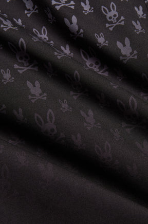 Gros plan du short maillot noir à motif lapin tête de mort gris foncé et texture tissée lisse pour homme par Psycho Bunny