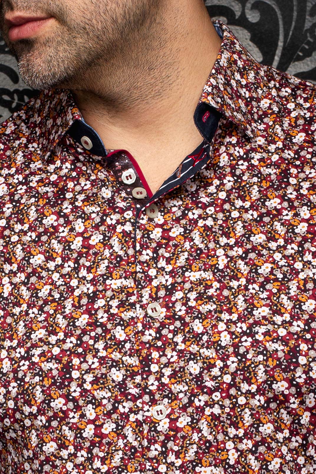Au Noir men's burgundy floral shirt collar, white buttons, and dark contrast inner placket, close-up