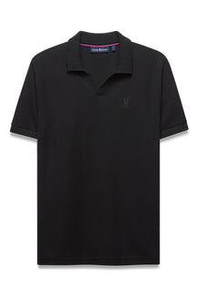 Men's black polo front view with ribbed collar, open placket, tonal chest logo and pink neck trim by Psycho Bunny