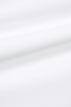 Psycho Bunny men's white textured knit fabric with subtle ridges and folds, close-up