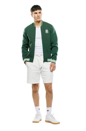 Vue avant complète du jacket bomber verte zippé avec poignets rayés vert pâle et ourlet pour homme par Psycho Bunny