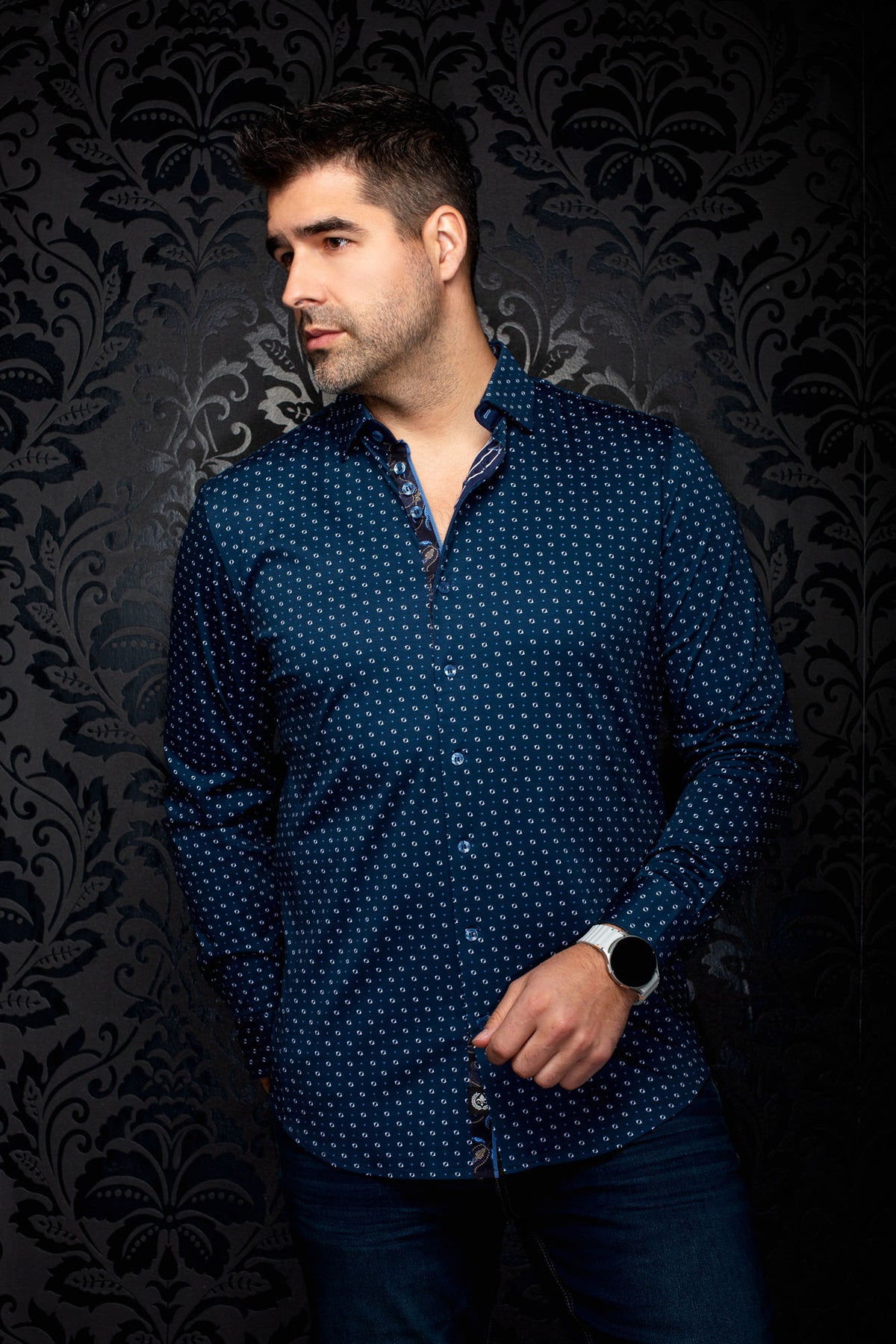 Men's navy blue geometric print button-up shirt on model in angled front view with contrast placket by Au Noir