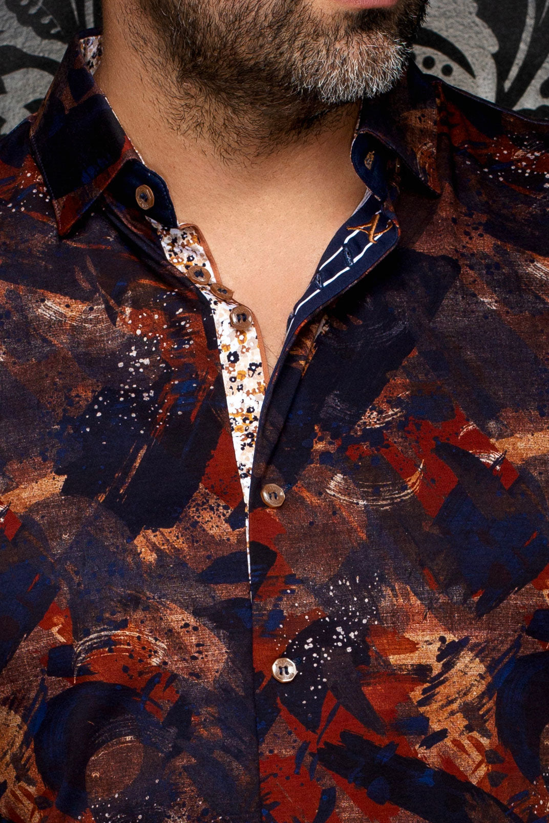 Au Noir men's navy abstract print shirt collar, buttons, and white contrast inner placket, close-up