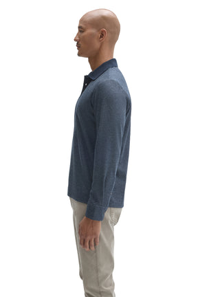 Side view of men's blue textured long sleeve polo with button cuff and dark ribbed collar by Robert Barakett