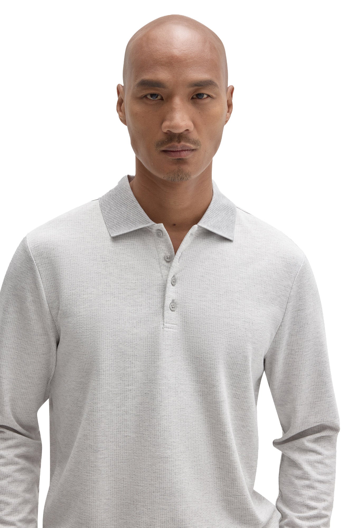 Men's close front detail of a light grey long sleeve polo with ribbed collar and buttons by Robert Barakett