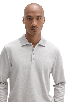 Men's close front detail of a light grey long sleeve polo with ribbed collar and buttons by Robert Barakett