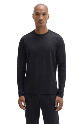 Front view of men's black long sleeve crew neck T-Shirt with tonal raised geometric texture by Robert Barakett