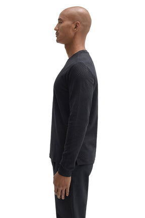 Side view of men's black long sleeve crew neck T-Shirt with tonal geometric rib texture by Robert Barakett