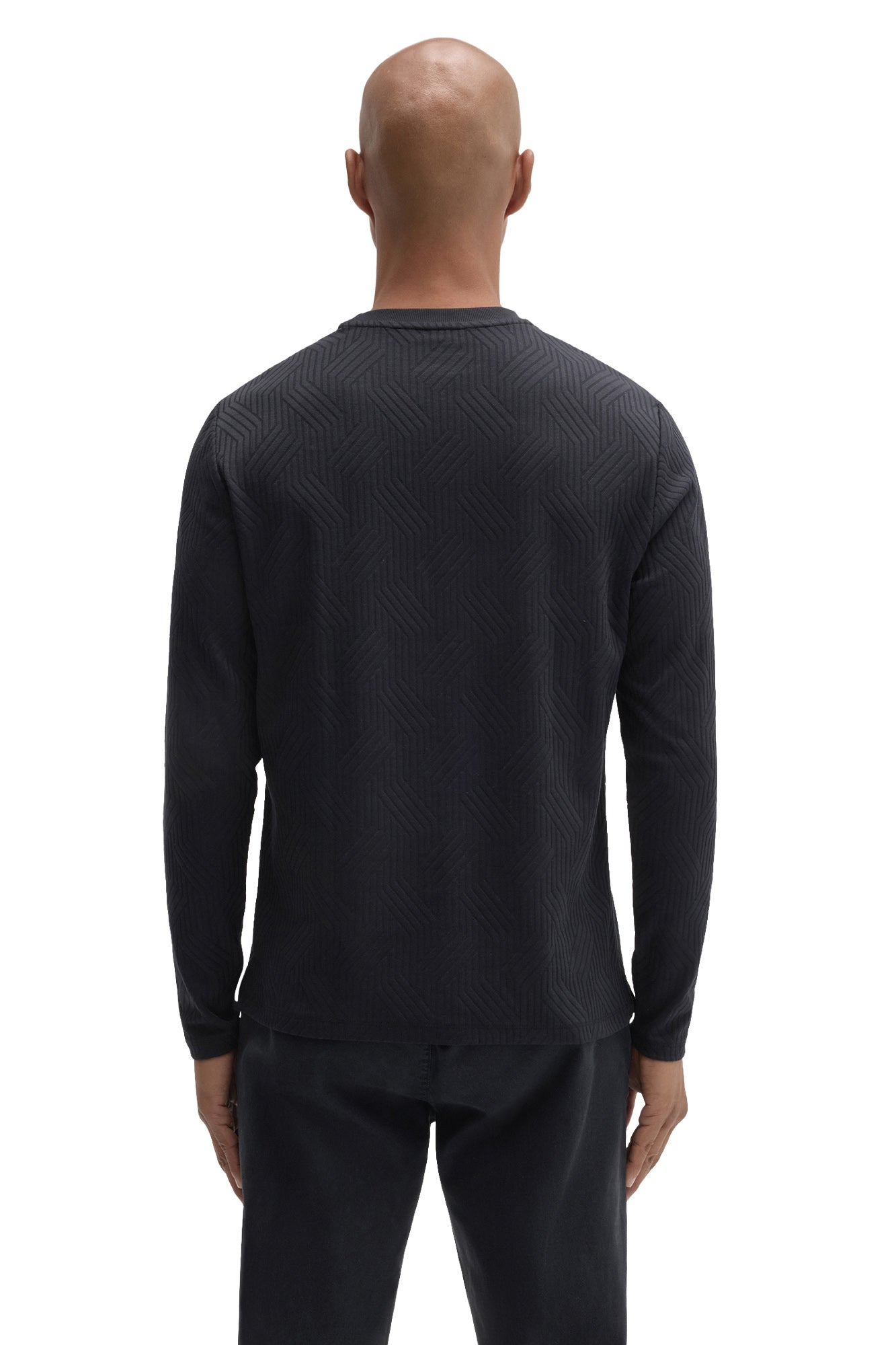 Back view of men's black long sleeve crew neck T-Shirt with tonal raised geometric texture by Robert Barakett