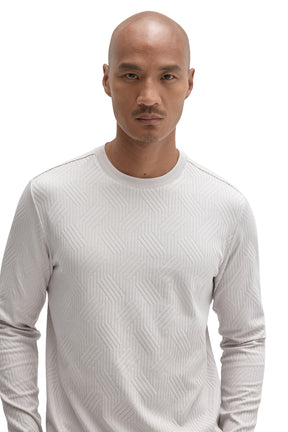 Close-up of men's light gray crew neck Long-sleeve T-Shirt showing raised geometric texture by Robert Barakett