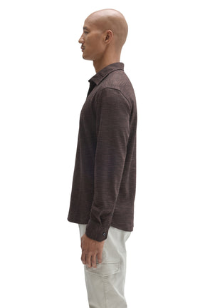 Robert Barakett men's dark brown long sleeve button-up shirt showing cuff button, shoulder seam and collar, side view