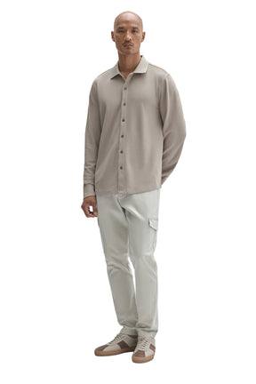 Men's full front view of a light taupe long sleeve knit button-front shirt with straight hem by Robert Barakett