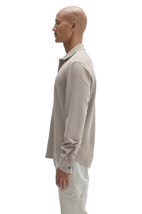 Side view of men's light taupe long sleeve knit button-front shirt with ribbed collar and cuff by Robert Barakett