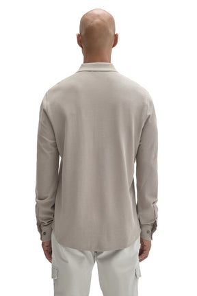 Back view of men's light taupe long sleeve knit button-front shirt with ribbed collar and cuffs by Robert Barakett