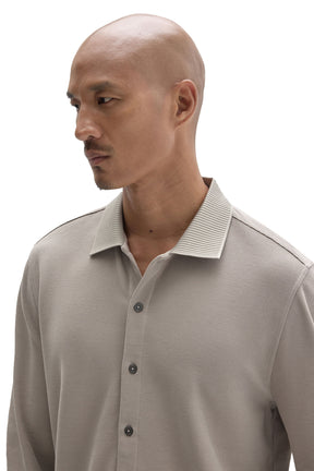 Robert Barakett men's close front view of a light taupe long sleeve knit button-front shirt with ribbed collar