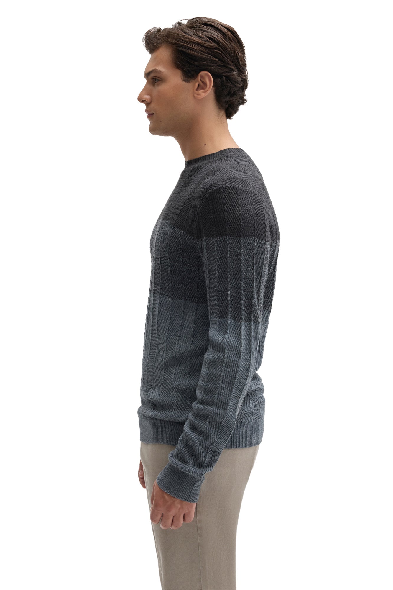 Side view of men's charcoal and blue-gray crewneck knit long-sleeve knit sweater showing ribbed cuff by Robert Barakett