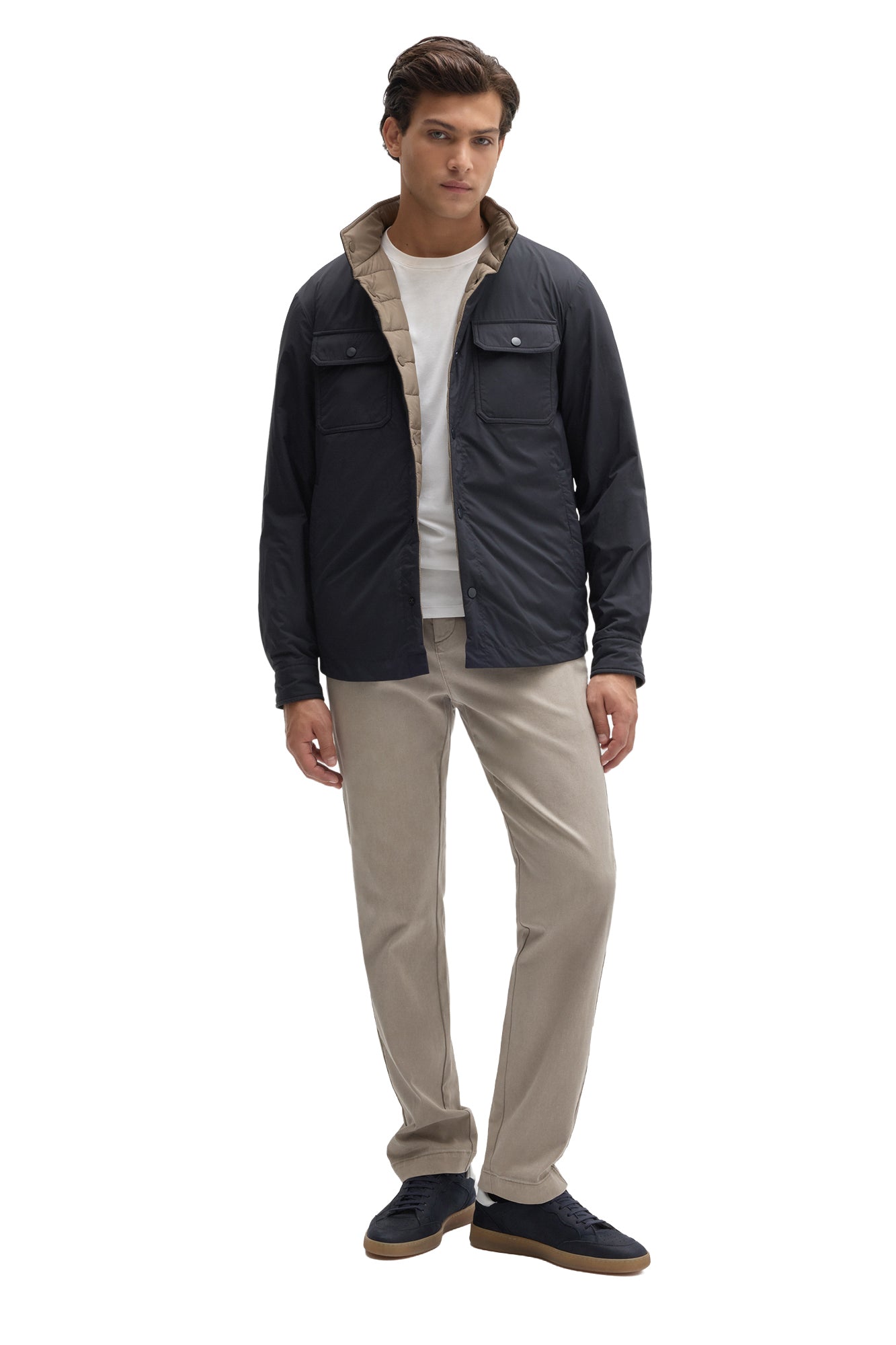 Men's full front view of navy reversible snap jacket worn open with taupe quilted lining visible by Robert Barakett