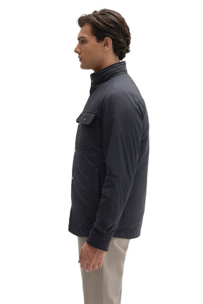 Side view of men's navy snap jacket with side hand pocket, chest flap pocket and stand collar by Robert Barakett