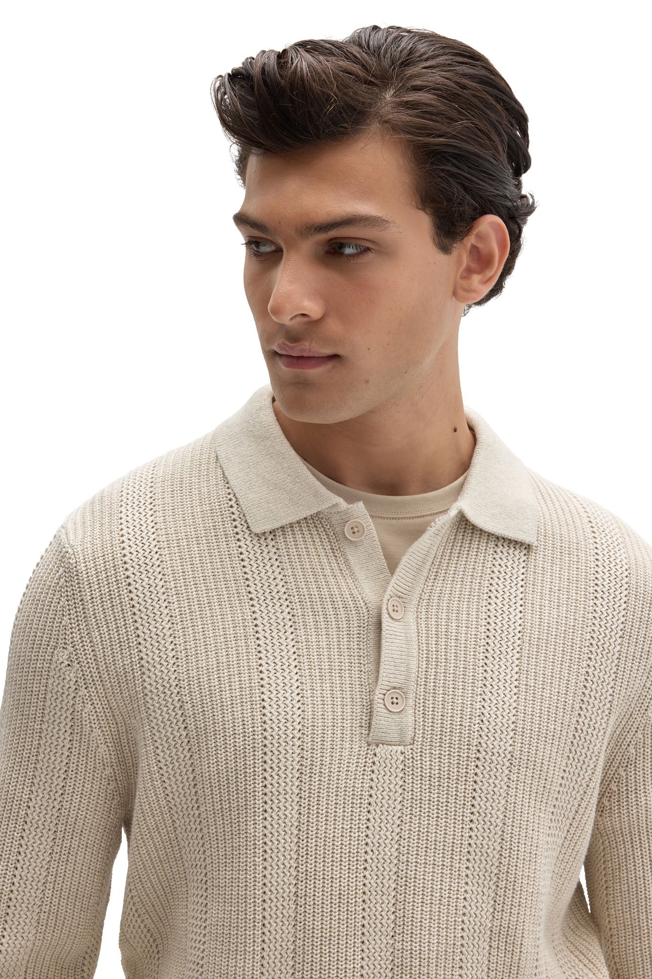Close-up of men's cream textured knit long-sleeve polo with fold-over collar and tonal button placket by Robert Barakett