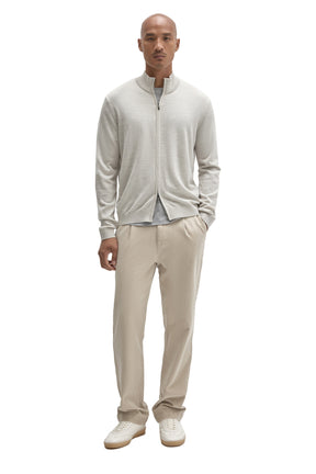 Robert Barakett men's full-body front view of a light beige full-zip knit long-sleeve knit sweater styled with neutral pants