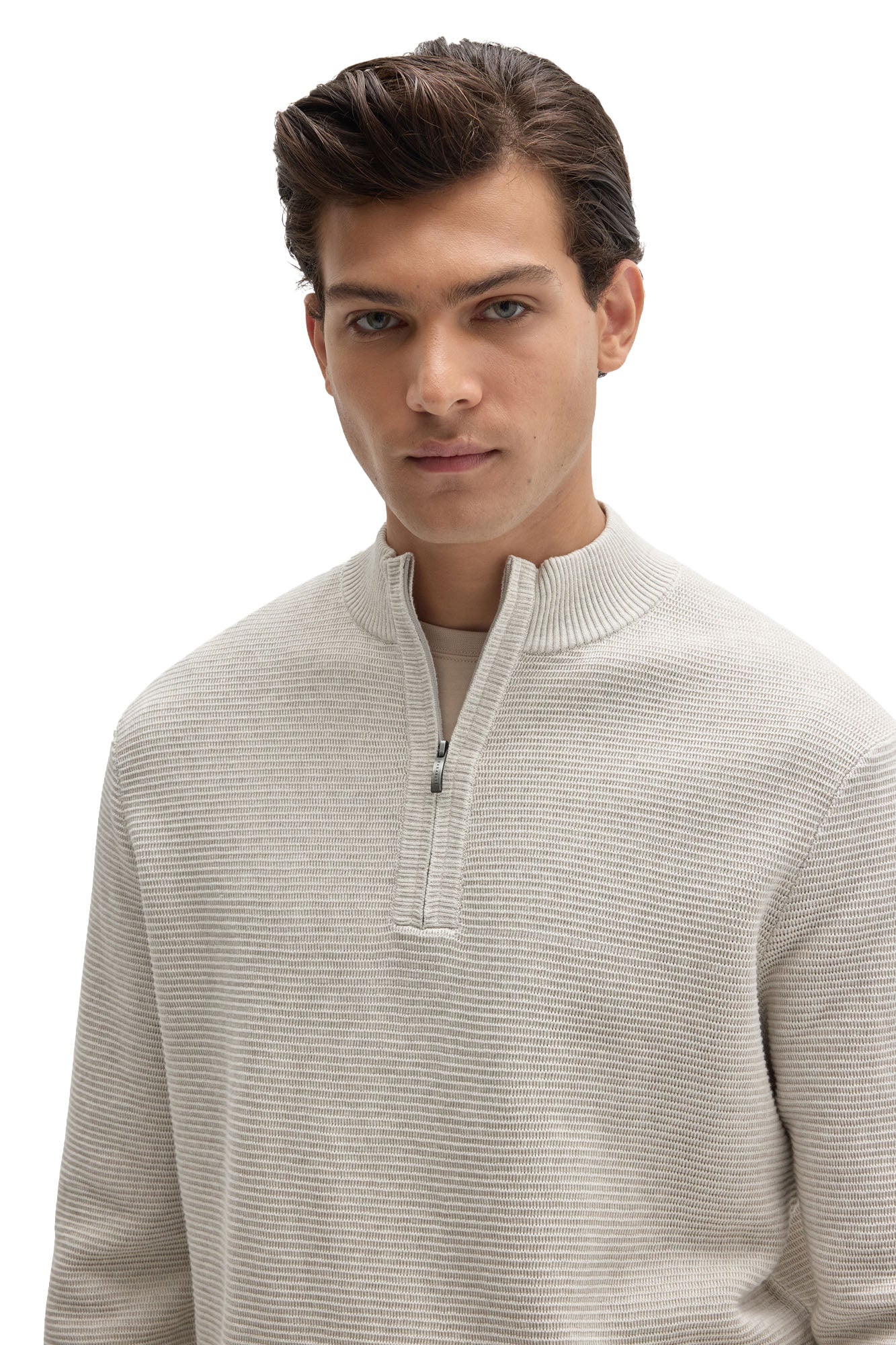 Men's close front detail of an off-white half-zip knit long-sleeve knit sweater with ribbed stand collar by Robert Barakett